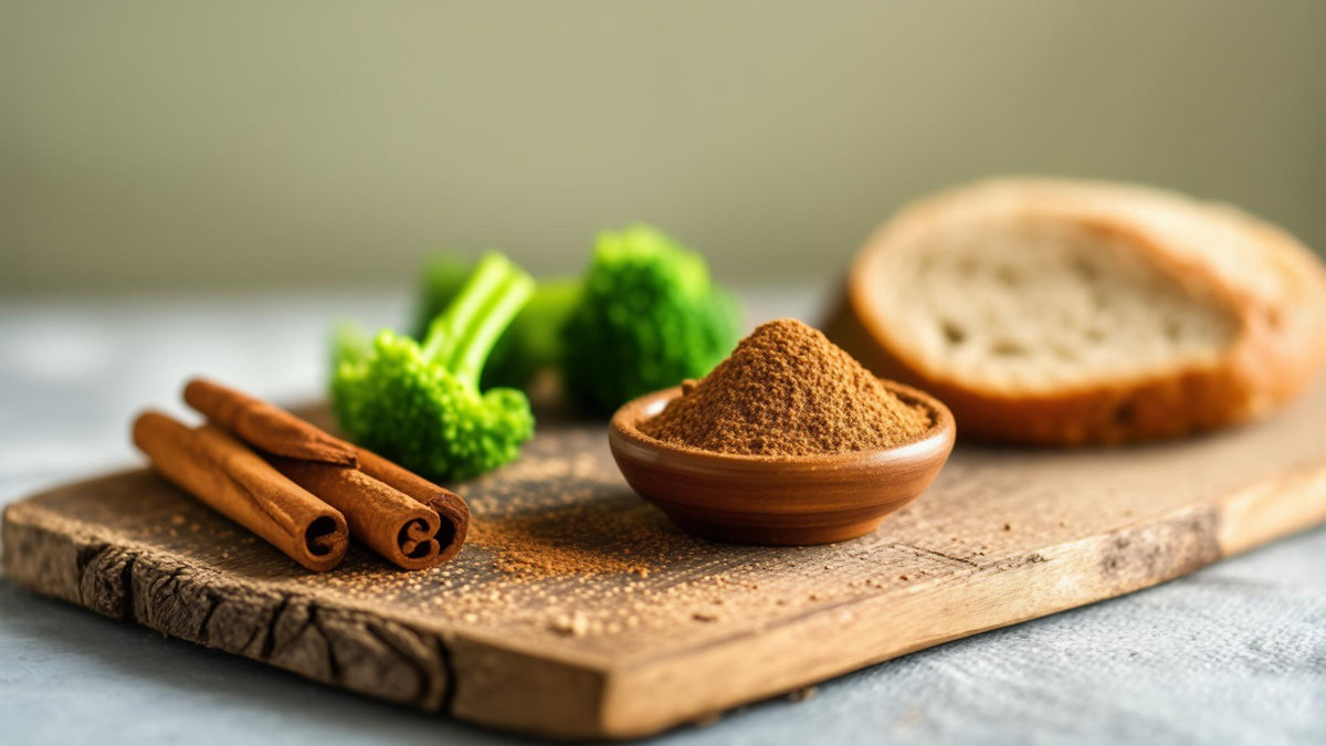 Cinnamon sticks, ground cinnamon, broccoli and whole-grain bread on a wooden board