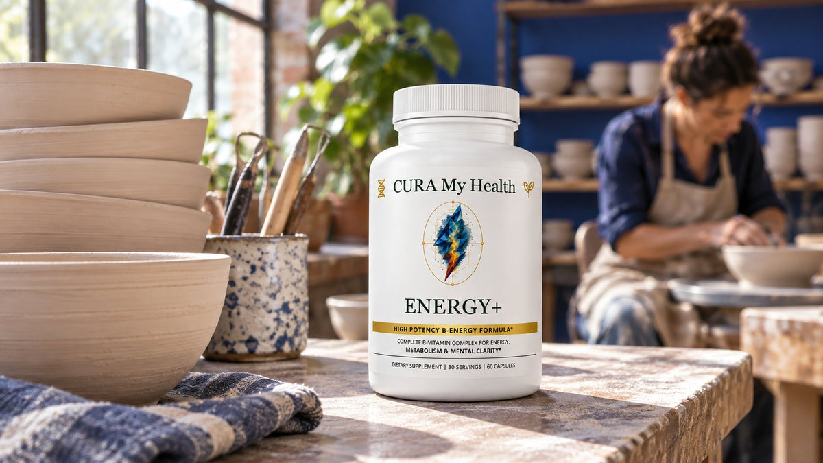 Energy+ bottle on a wooden table in a bright pottery studio, with a potter working in the background