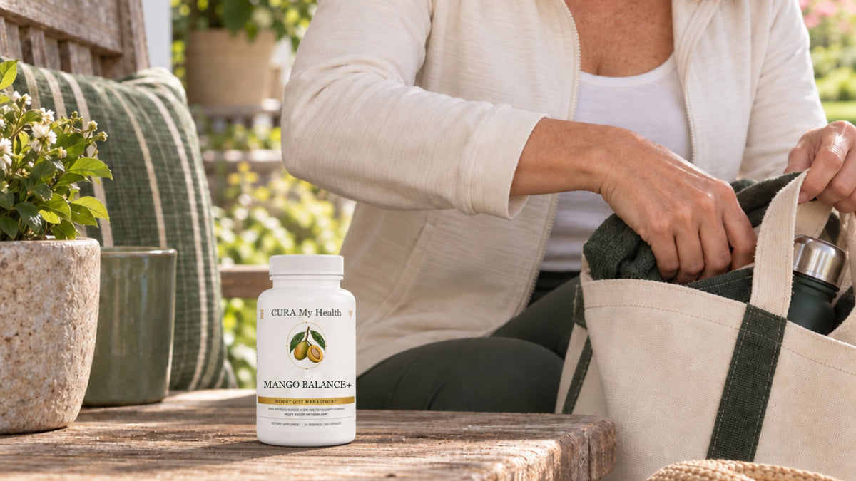 Mango Balance+ bottle on a wooden table while a person packs a tote bag outdoors