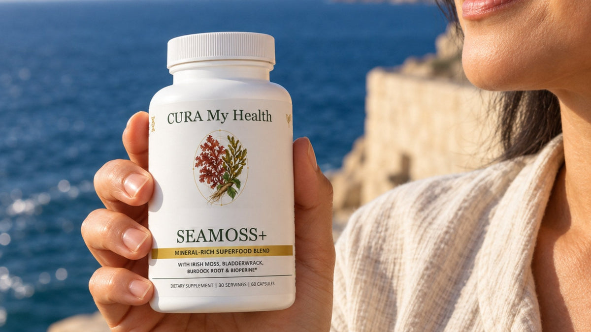 A person holding a Seamoss+ bottle by the sea