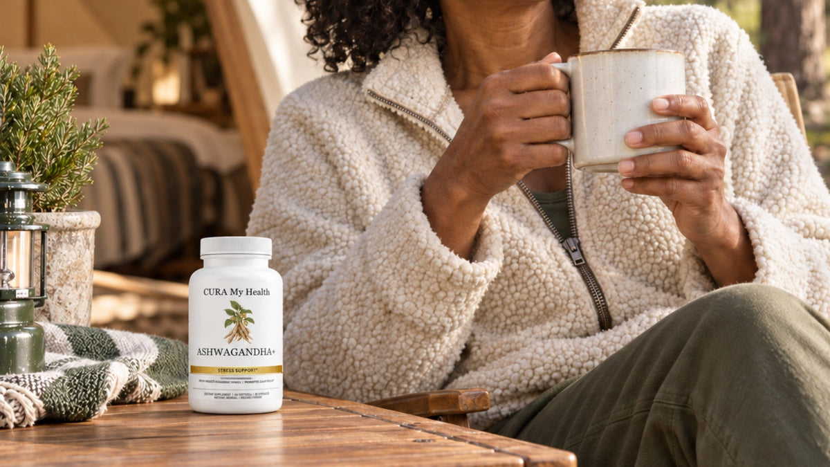 Ashwagandha+ bottle on a wooden table beside a person holding a warm mug on a patio