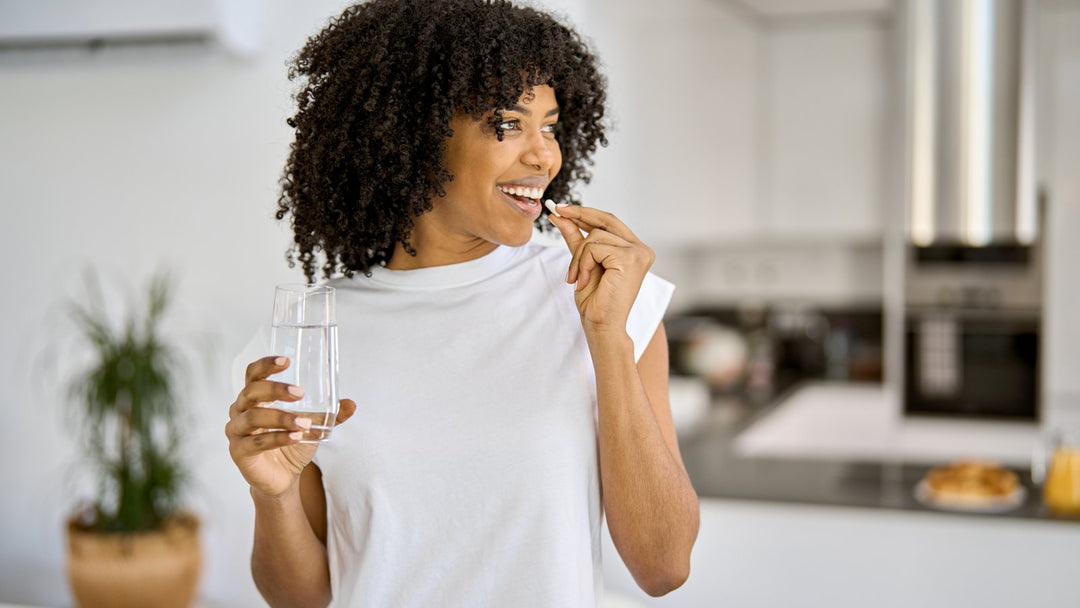 Calm, centered woman taking a breath during a busy day