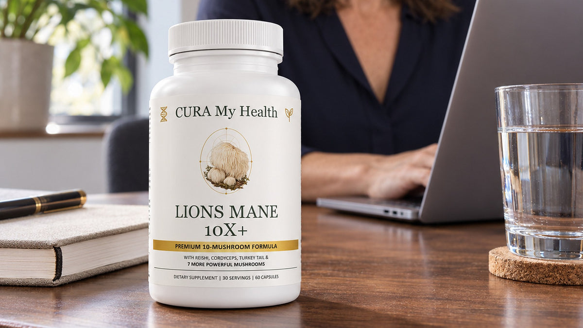 Lions Mane 10x+ bottle on a desk beside a notebook and a glass of water while a person works on a laptop